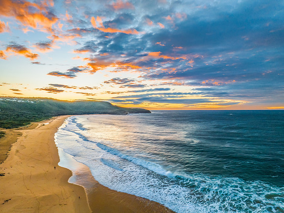 Surf, sea, sand, sunrise with clouds
