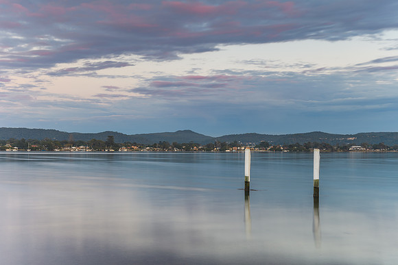 Cloudy Reverse Sunrise Waterscape over the Bay
