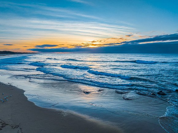 Sunrise seascape with waves