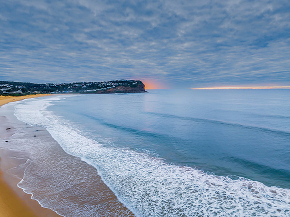 Stratus cloud filled sunrise over the ocean