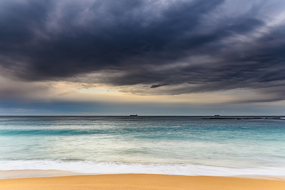 Early morning seascape with heavy clouds