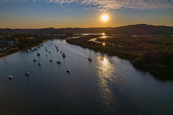 Late afternoon aerial waterscape over the bay with high clouds