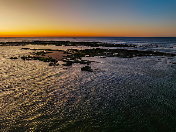 Aerial sunrise seascape with  clear skies