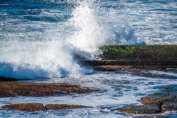 Splashes on the mossy sea pipe
