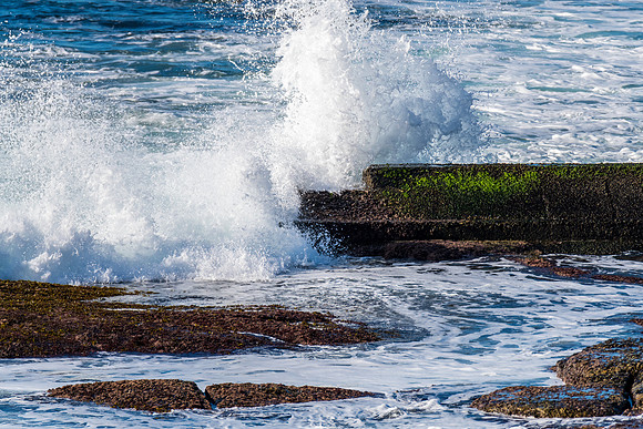 Splashes on the mossy sea pipe