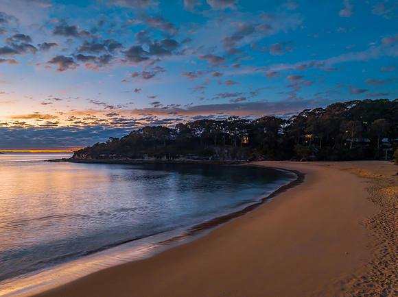 Aerial sunrise seascape with pretty cloud filled sky