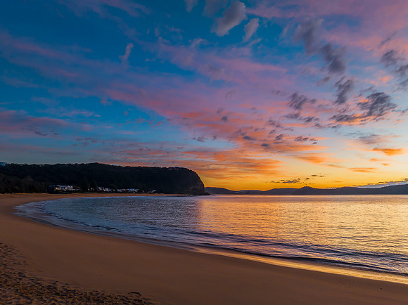 Aerial sunrise seascape with pretty cloud filled sky