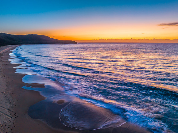 Sunrise at the seaside with orange horizon