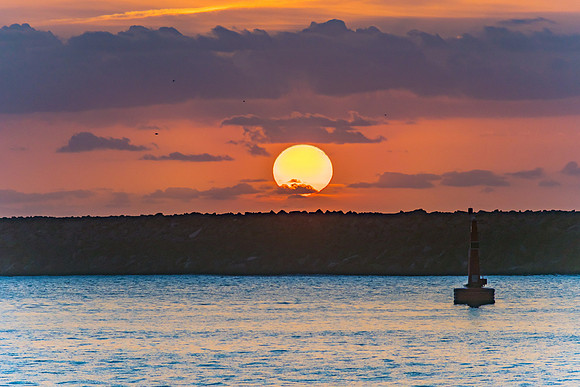 Sun Rising over the Breakwall Seascape