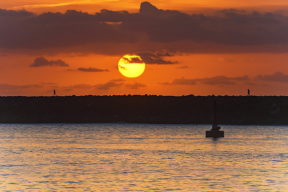 Sun Rising over the Breakwall Seascape