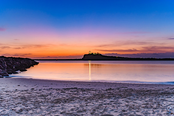 Pink and Purple Dawn Seascape and Lighthouse
