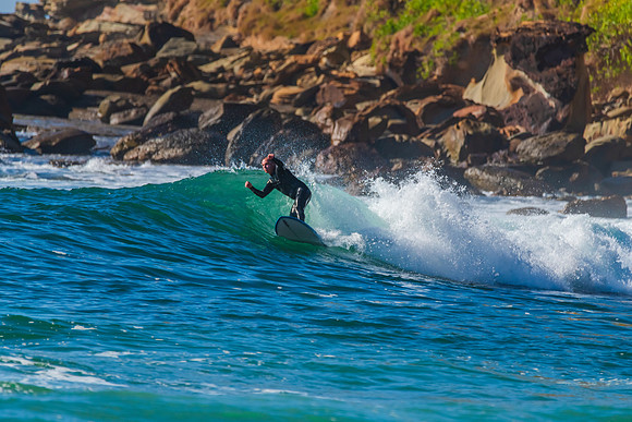 Clear blue skies and surfs up at the seaside
