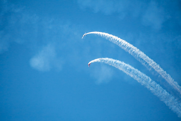 Aerobatic flight display in the blue sky
