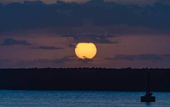 Sun Rising over the Breakwall Seascape