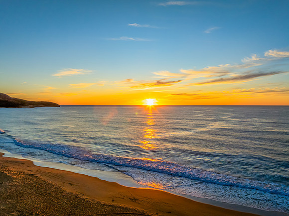 Sunrise at the seaside with high cloud