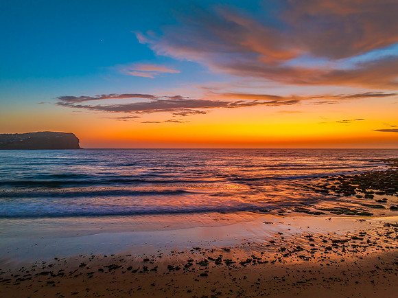 Sunrise at the seashore with clouds