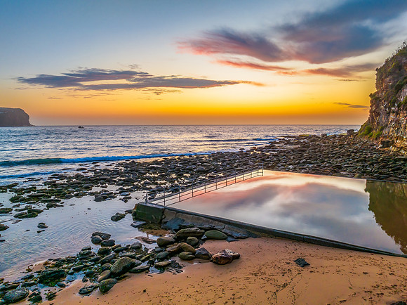 Sunrise at the seashore with colour in the clouds
