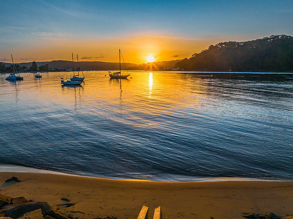 Early morning sunrise views at the waterfront where the water me