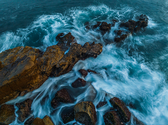 Blue hour, rocks and the sea