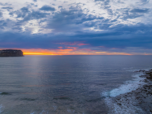 Cloud filled sunrise seascape