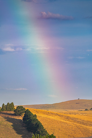 Rainbow after the storm over the rural countryside