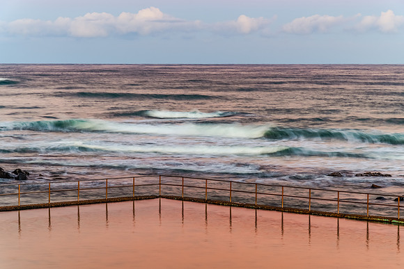 Sunset at the Seaside with black rocks