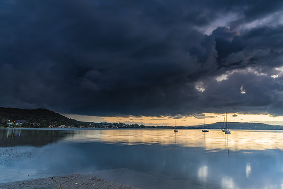 Heavy and Dramatic Waterscape with Boats