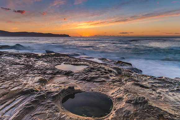 Sunrise and the twin rock pools