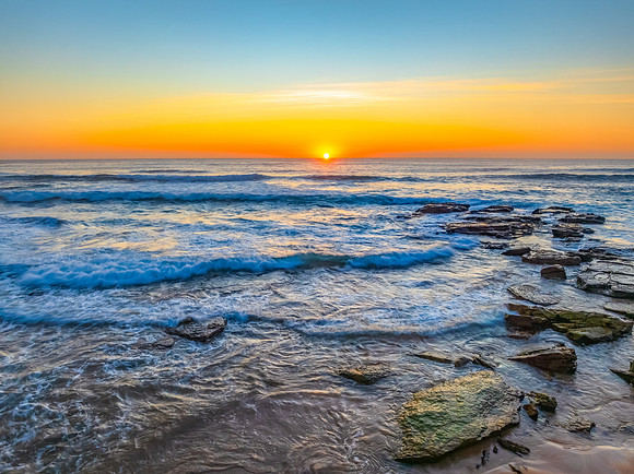 Sunrise at the Seaside with an Orange Horizon