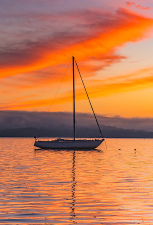 Orange Sunrise and Boat on the Bay