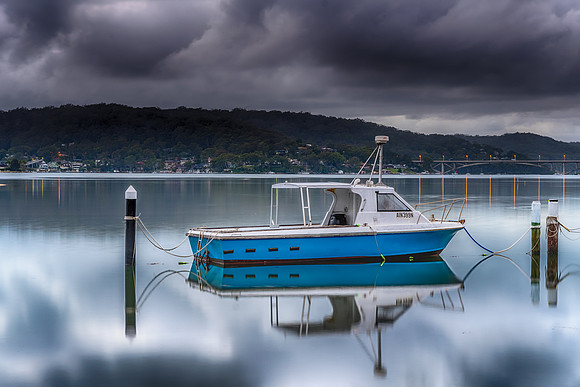 Early Morning Reflections and the Blue Boat