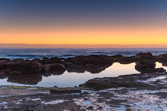 Coastal Dawn Rock Reflections