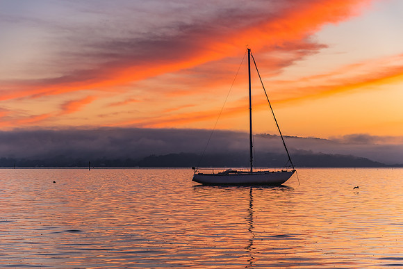Orange Sunrise and Boat on the Bay