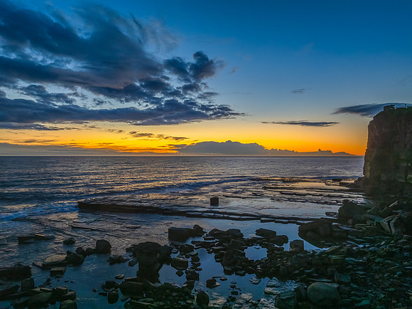 Sunrise over the ocean and rocky Inlet