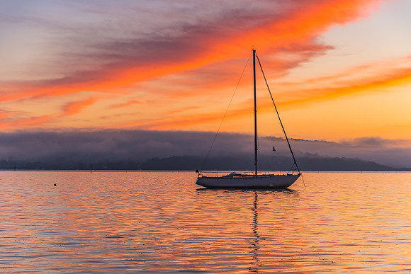 Orange Sunrise and Boat on the Bay