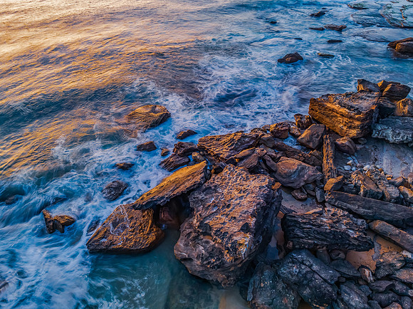 Pretty blue sunrise at the beach with calm seas
