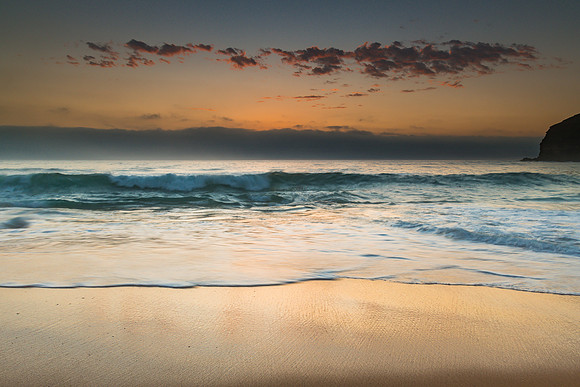 Sunrise Seascape the Beach and Low Cloud Bank