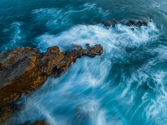 Blue hour, rocks and the sea