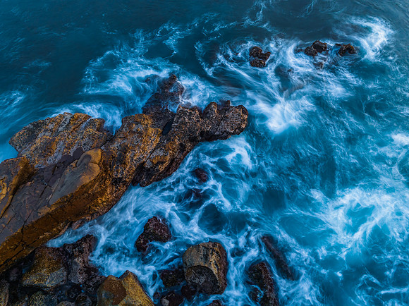 Blue hour, rocks and the sea