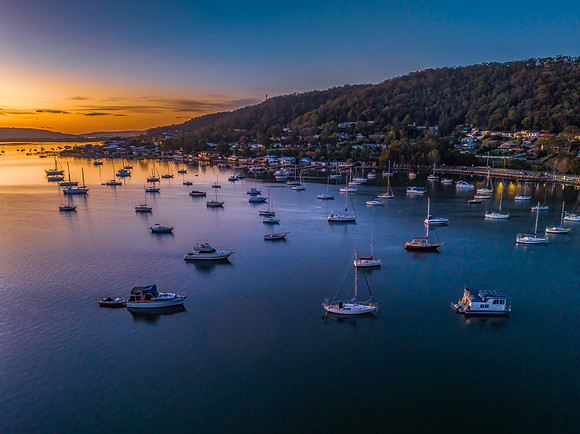 Aerial sunrise waterscape with boats