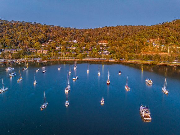 Aerial sunrise waterscape with boats