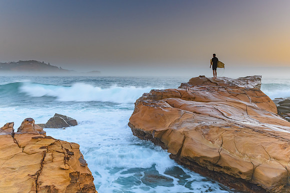 Misty Seascape with Surfer on the Rock