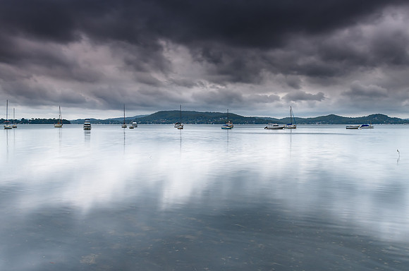 Overcast and Cloudy Bay with Boats