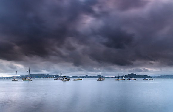 Overcast and Cloudy Bay with Boats