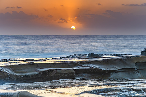 Hazy Sunrise Seascape from Rock Platform