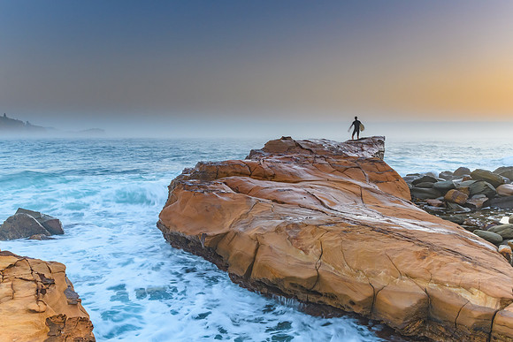 Misty Seascape with Surfer on the Rock
