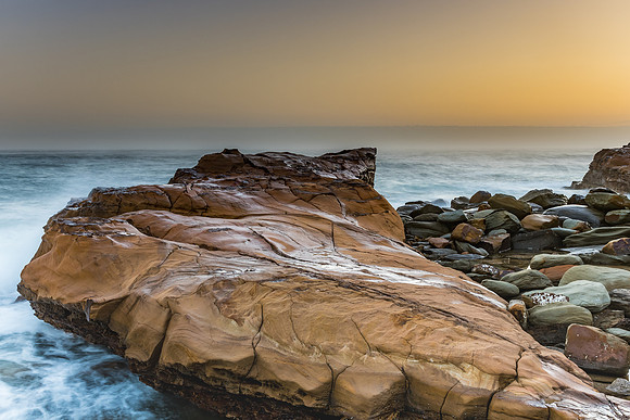 Early Morning Misty Seascape with Rock