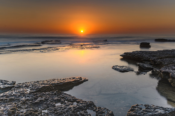 Vibrant Rocky Beach Sunrise Seascape