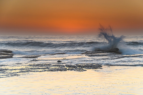 Orange Glow Sunrise Seascape with Splash