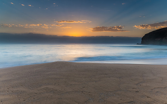 Sunrise Seascape the Beach and Low Cloud Bank